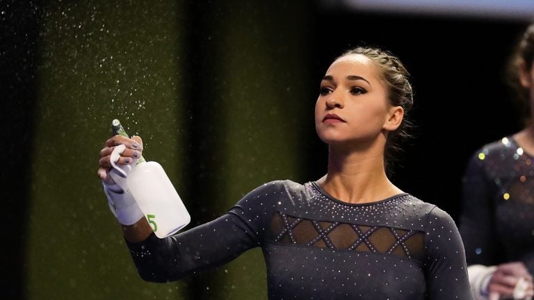 Gymnast spraying water