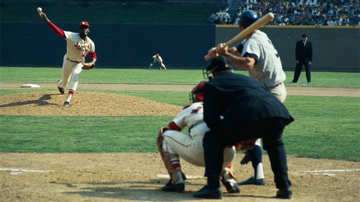 St. Louis Cardinals Bob Gibson throws the first pitch of the 1968 World Series