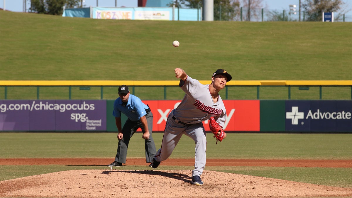 Baseball pitcher throwing a pitch during game