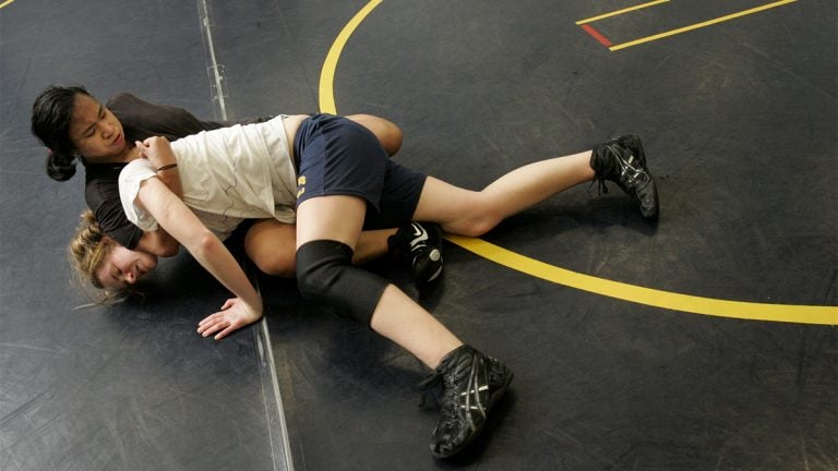 Two girls wrestling