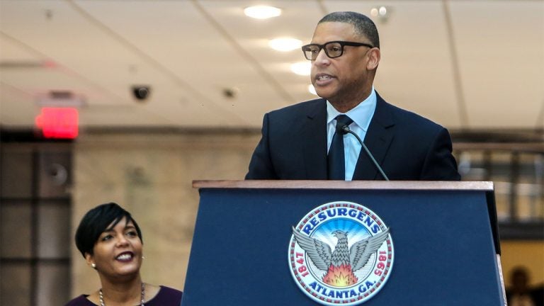 Arthur McAfee standing at a podium