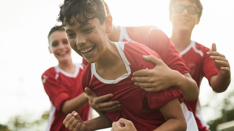 A soccer player celebrates a goal.