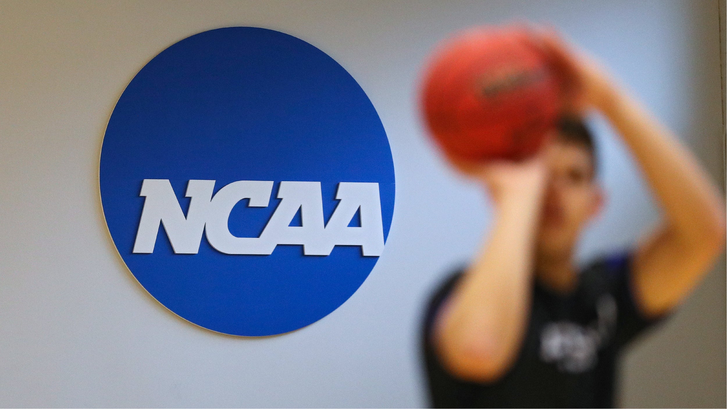 BALTIMORE, MARYLAND - MARCH 06: A NCAA logo is seen on the wall as Yeshiva players warmup prior to playing against Worcester Polytechnic Institute during the NCAA Division III Men's Basketball Championship - First Round at Goldfarb Gymnasium on at Johns Hopkins University on March 6, 2020 in Baltimore, Maryland. On Thursday, Maryland Gov. Larry Hogan announced that Maryland had confirmed three cases of residents with COVID-19, otherwise known as the Coronavirus, prompting Johns Hopkins officials to host the NCAA men's basketball tournament without spectators. (Photo by Patrick Smith/Getty Images)