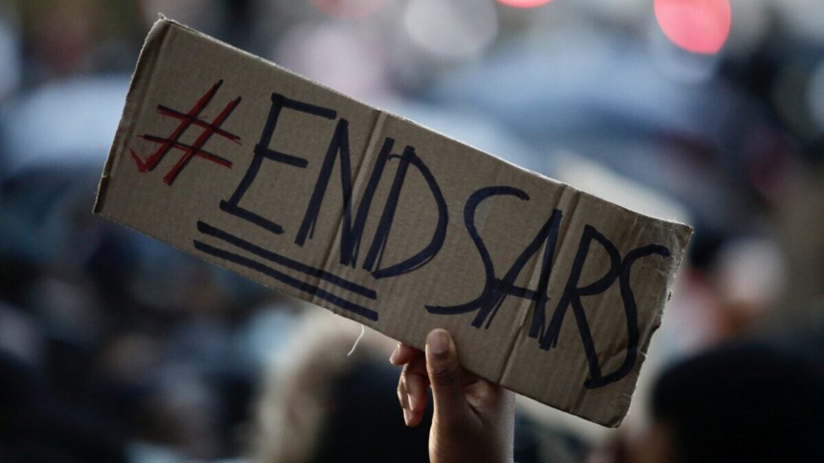 LONDON, UNITED KINGDOM - OCTOBER 21: People gather to march to Parliament Square to stage a protest against the attacks towards demonstrators during the ongoing protests in Nigeria against Nigeria's Special Anti-Robbery Squad (SARS), which is a branch of the Nigeria Police Force under the State Criminal Investigation and Intelligence Department (SCIID), in London, United Kingdom on October 21, 2020. (Photo by Hasan Esen/Anadolu Agency via Getty Images)