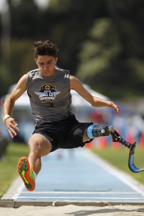 Ezra Frech shown mid-air doing the long jump. (Photo courtesy of Angel City Sports)