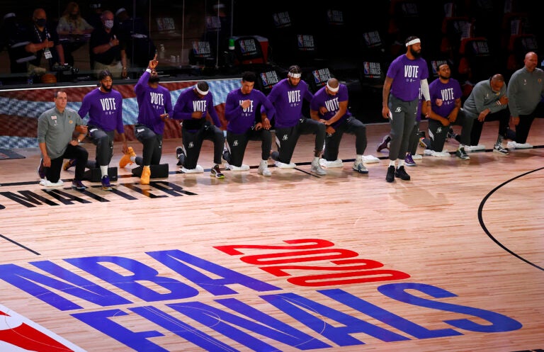 NBA players kneeling in the Bubble